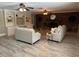 Cozy living room featuring built-in shelving, a fireplace, and comfortable seating at 7108 East Rd, Lakeland, FL 33809