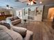 Open-concept living area boasts built-in shelving and storage, and comfortable seating arrangements at 7108 East Rd, Lakeland, FL 33809