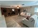 Inviting living room features a cozy brick fireplace, comfortable seating, and stylish decor at 7108 East Rd, Lakeland, FL 33809