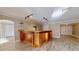 Spacious bonus room includes tile floors, custom bar, new windows, and fresh paint at 7108 East Rd, Lakeland, FL 33809