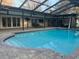 Outdoor seating area and swimming pool enclosed by screening at 7108 East Rd, Lakeland, FL 33809