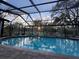 Inviting screened pool with waterfall feature at 7108 East Rd, Lakeland, FL 33809