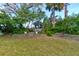 Serene backyard featuring a quaint gazebo, lush greenery, and tiered landscaping for ultimate relaxation at 72 Rockefeller Dr, Ormond Beach, FL 32176