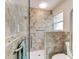 Accessible bathroom with tiled walk-in shower, grab bars, and safety features at 72 Rockefeller Dr, Ormond Beach, FL 32176