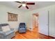 Bright bedroom with hardwood floors, comfortable seating, and ample natural light at 72 Rockefeller Dr, Ormond Beach, FL 32176