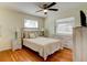 Bright bedroom with hardwood floors, ceiling fan, and neutral colors scheme at 72 Rockefeller Dr, Ormond Beach, FL 32176