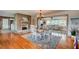 Sunlit dining room with a wood burning fireplace and luxury flooring at 72 Rockefeller Dr, Ormond Beach, FL 32176