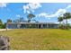 Charming single story home with manicured front lawn and attached garage at 72 Rockefeller Dr, Ormond Beach, FL 32176