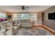 Comfortable living room featuring luxury flooring and a large window with natural sunlight at 72 Rockefeller Dr, Ormond Beach, FL 32176