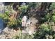 Aerial view of a home nestled among lush trees, showcasing its serene and private setting at 749 Cassadaga Rd, Lake Helen, FL 32744