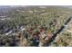 Aerial shot showcasing the property's wooded acreage outlined in red at 749 Cassadaga Rd, Lake Helen, FL 32744