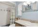 Bathroom featuring a shower, light blue walls and a neutral vanity at 749 Cassadaga Rd, Lake Helen, FL 32744