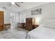 Bedroom showcases neutral decor, a ceiling fan and an ensuite bathroom at 749 Cassadaga Rd, Lake Helen, FL 32744