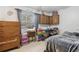 Bedroom with natural light, neutral walls, tile floors, and ceiling fan at 749 Cassadaga Rd, Lake Helen, FL 32744