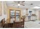 Eat-in kitchen features stainless steel appliances, light cabinets, and a ceiling fan at 749 Cassadaga Rd, Lake Helen, FL 32744
