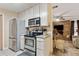 Kitchen has stainless steel appliances, including a range and refrigerator at 749 Cassadaga Rd, Lake Helen, FL 32744