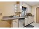 Kitchen featuring stainless steel appliances and light colored cabinetry at 749 Cassadaga Rd, Lake Helen, FL 32744