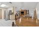 Open concept living room and kitchen with a fireplace and stainless steel appliances at 749 Cassadaga Rd, Lake Helen, FL 32744