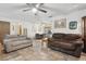 Spacious living area with a brick fireplace and access to dining area at 749 Cassadaga Rd, Lake Helen, FL 32744