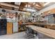 Shed interior featuring a peg board for tools, workbenches, and shelving for storage at 749 Cassadaga Rd, Lake Helen, FL 32744