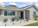 Charming front yard featuring decorative rock landscaping and a well-maintained walkway to the front door at 755 Fairlawn Dr, Orange City, FL 32763