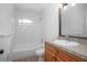 Bathroom featuring a tub, and a single sink vanity with a large mirror at 818 W Pennsylvania Ave, Deland, FL 32720