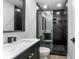Modern bathroom with a glass-enclosed shower and black fixtures at 818 W Pennsylvania Ave, Deland, FL 32720