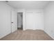 Bedroom with two closets and a door to another room, with neutral carpeting at 818 W Pennsylvania Ave, Deland, FL 32720