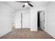 Bedroom with ceiling fan, walk in closet and entry to additional room at 818 W Pennsylvania Ave, Deland, FL 32720