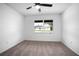 Bright bedroom with a ceiling fan and a large window creates a relaxing atmosphere at 818 W Pennsylvania Ave, Deland, FL 32720