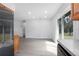 Updated kitchen featuring wood cabinets, granite countertops, stainless steel appliances, and open view of the living room at 818 W Pennsylvania Ave, Deland, FL 32720