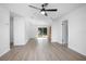 Bright living room featuring modern flooring, shiplap accent wall, recessed lighting, and sliding glass doors at 818 W Pennsylvania Ave, Deland, FL 32720