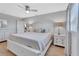 Bright bedroom with wood floors, a ceiling fan, and a large bed at 857 Westchester Dr, Deland, FL 32724