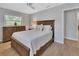 Bedroom with wood floors, neutral paint, a ceiling fan, and natural light from the window at 857 Westchester Dr, Deland, FL 32724