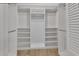 Walk-in closet with custom shelving and organization offering ample storage space at 857 Westchester Dr, Deland, FL 32724