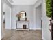 Bright foyer with stylish herringbone floors and a decorative mirror, creating a welcoming entrance at 857 Westchester Dr, Deland, FL 32724
