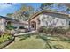 Beautiful home featuring a brick archway entrance and landscaped front yard at 857 Westchester Dr, Deland, FL 32724