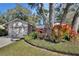 Attractive home exterior with a lovely landscaped garden and an attached two-car garage at 857 Westchester Dr, Deland, FL 32724