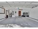 Spacious garage featuring neutral paint and garage door at 857 Westchester Dr, Deland, FL 32724