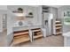 Kitchen features pull out storage, marble counters, gray cabinets, and stainless refrigerator at 857 Westchester Dr, Deland, FL 32724