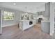 Spacious kitchen with a large island, stainless steel appliances, and bright, natural light at 857 Westchester Dr, Deland, FL 32724