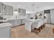 Bright kitchen features gray cabinets, stainless appliances, marble counters, and a large center island with seating at 857 Westchester Dr, Deland, FL 32724