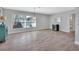 Open floorplan living area with hardwood flooring, bright natural light, and neutral paint colors at 857 Westchester Dr, Deland, FL 32724