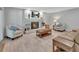 Living room with fireplace and painted white brick surround plus comfortable seating at 857 Westchester Dr, Deland, FL 32724