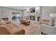 Bright living room with fireplace and view of the screened-in patio at 857 Westchester Dr, Deland, FL 32724