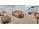 Open living space with tile floors, a leather couch, and view to the kitchen at 857 Westchester Dr, Deland, FL 32724