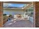 Comfortable outdoor patio with a brick wall and garden area, ideal for relaxation and entertaining at 857 Westchester Dr, Deland, FL 32724