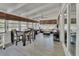 Spacious sunroom area with ceiling fan, dinette set and cozy seating at 857 Westchester Dr, Deland, FL 32724