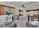 Bright sunroom area with backyard views, ceiling fan, dinette set, and cozy seating at 857 Westchester Dr, Deland, FL 32724