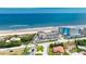 Aerial view of oceanfront condos offering beach access, community pool, parking, and proximity to roadways at 935 Ocean Shore Blvd # 4010, Ormond Beach, FL 32176